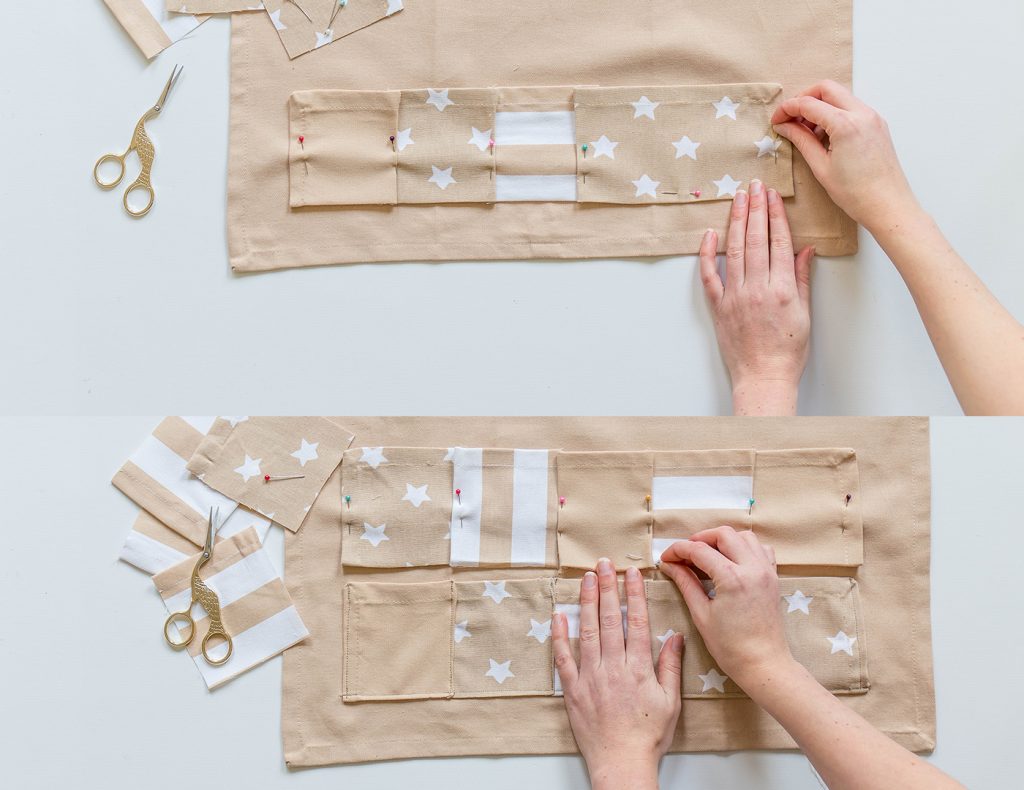 Mit Nadeln werden die Rechtecke auf dem großen Geschirrtuch festgesteckt und anschließend angenäht.